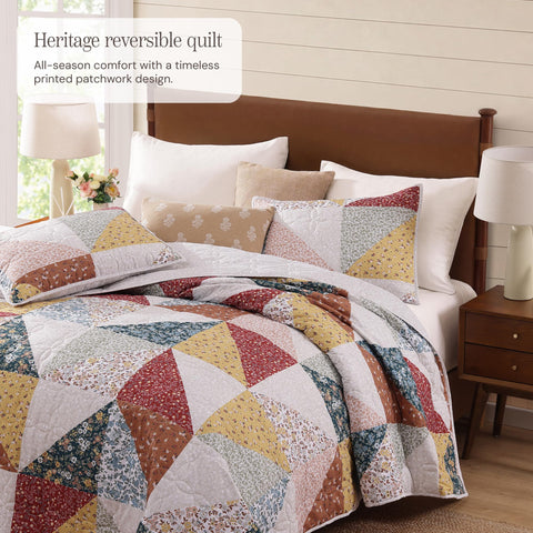 BLOOMHAVEN quilt set queen patchwork floral detail showcases vibrant color that lasts.