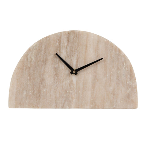 Bloomingville clock displayed on a stylish living room shelf.