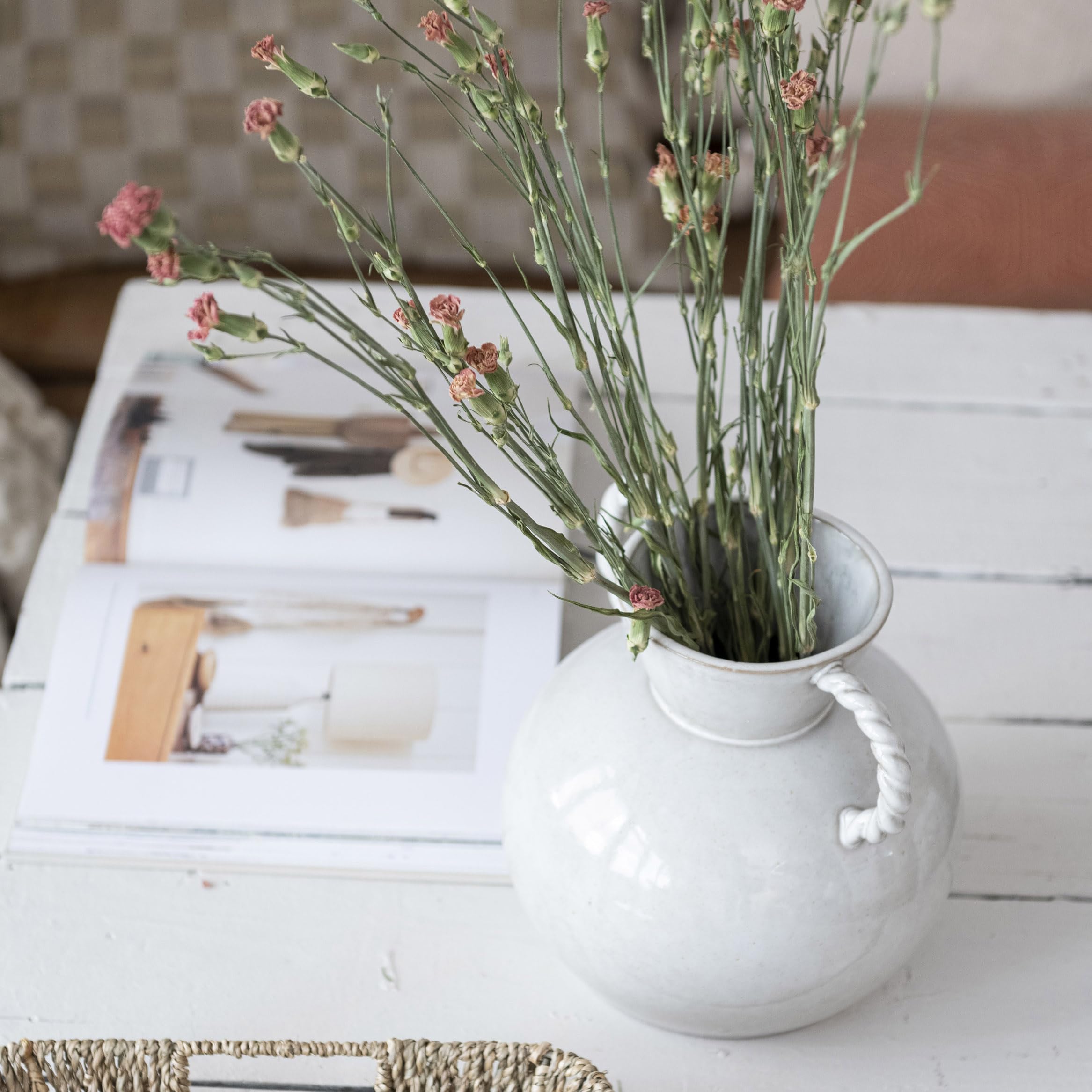 Bloomingville cream vase complements minimalist and traditional decor.