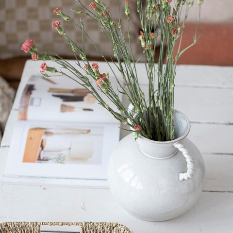 Bloomingville cream vase complements minimalist and traditional decor.