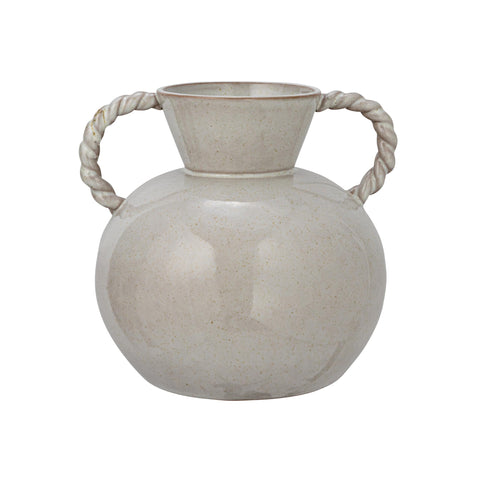 Bloomingville stoneware vase with flowers arrangement on mantel.