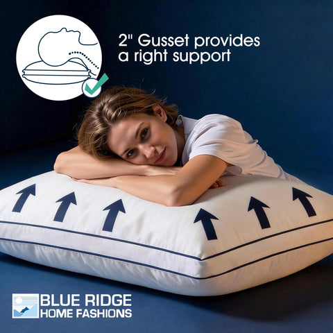Blue Ridge Home Fashions pillows resting on bed beside nightstand for relaxed evenings.