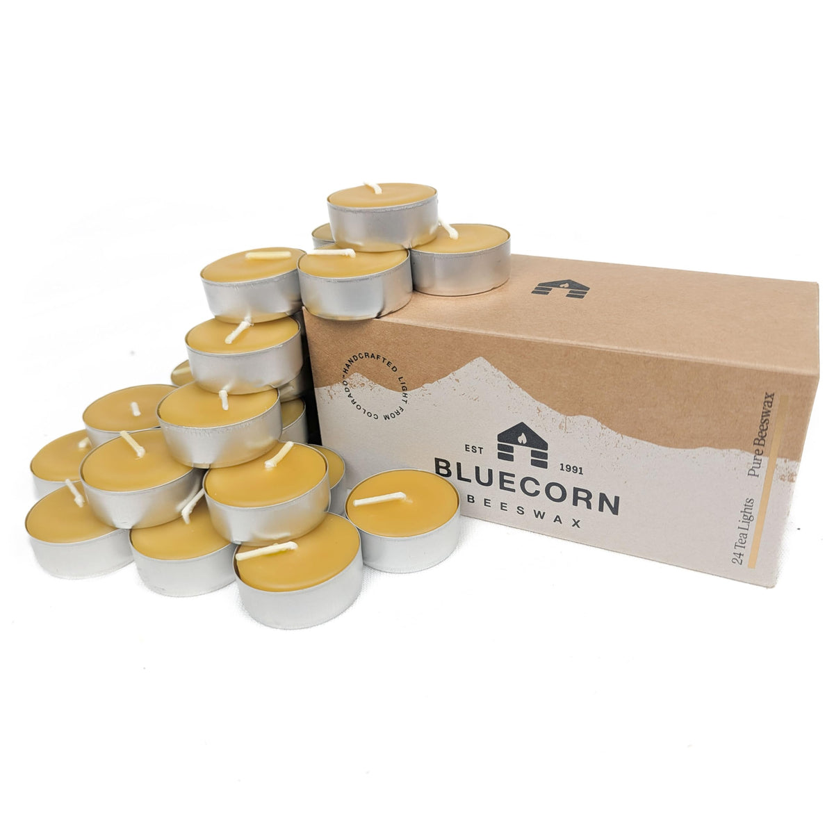 Bluecorn Beeswax tea light in a metal cup emitting a warm, inviting glow for ambiance