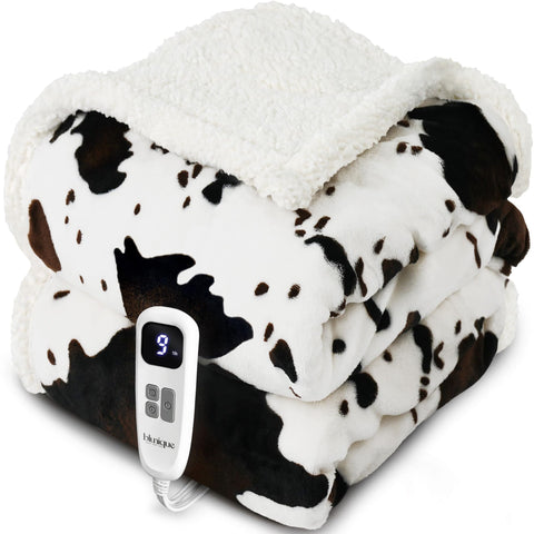 Blunique heated blanket in cow print white, folded for storage