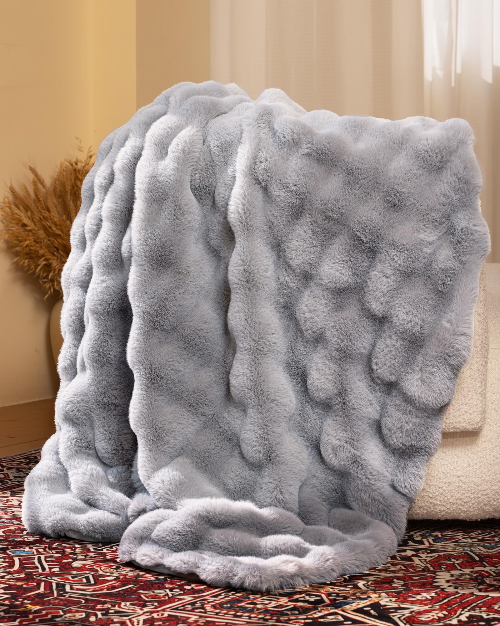 blunique Ultra Soft Cozy Faux Fur Throw on bed enhances warmth and style.