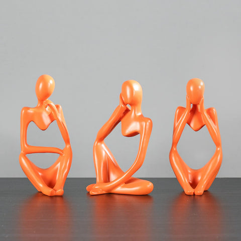 BMLCGJ golden thinker sculpture on mantel elevating living room style