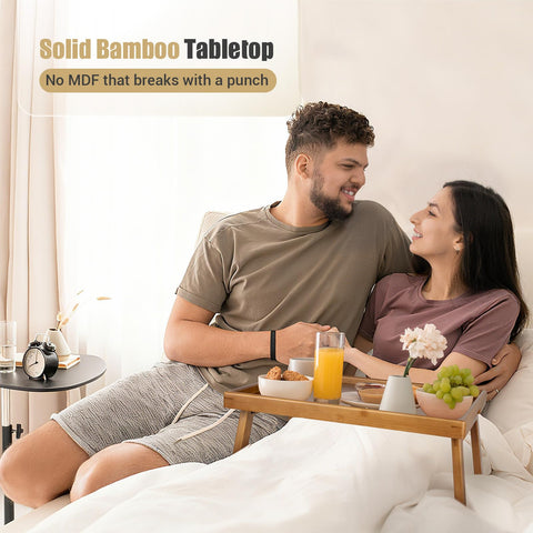 Bmboryxa bamboo tray features raised edges to prevent spills.