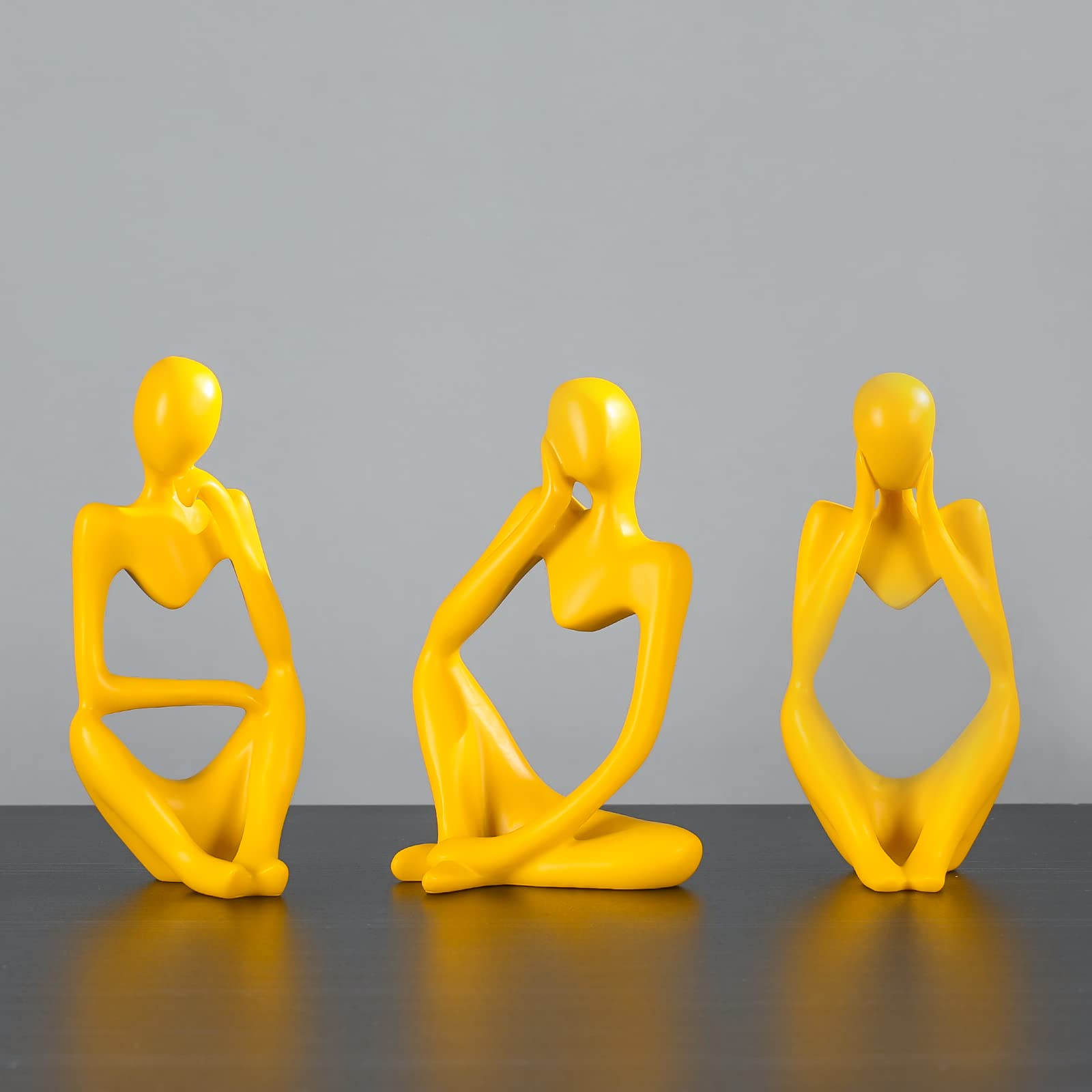 BMLCGJ Thinker statue for office shelf creates a calm, focused work area.