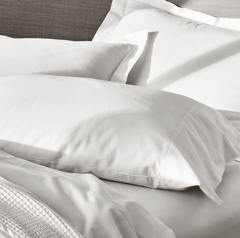 Boll and Branch Butter-soft texture closeup demonstrates luxurious hand feel on bed