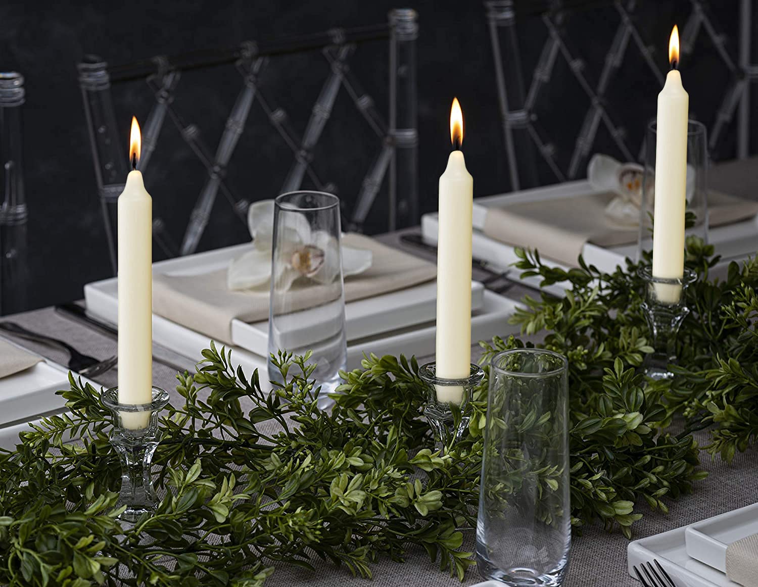 Ivory Bolsius candles in a candelabra offer classic elegance and reliability.
