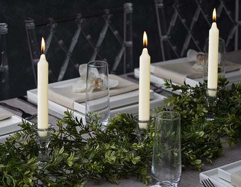 Ivory Bolsius candles in a candelabra offer classic elegance and reliability.