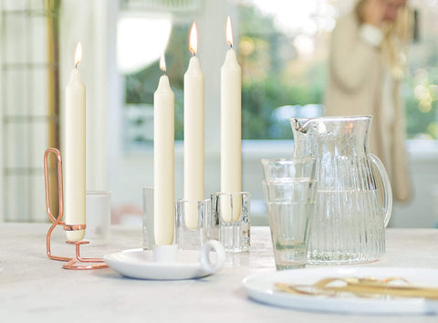 7-inch tall Bolsius ivory candles set a warm dinner table glow.