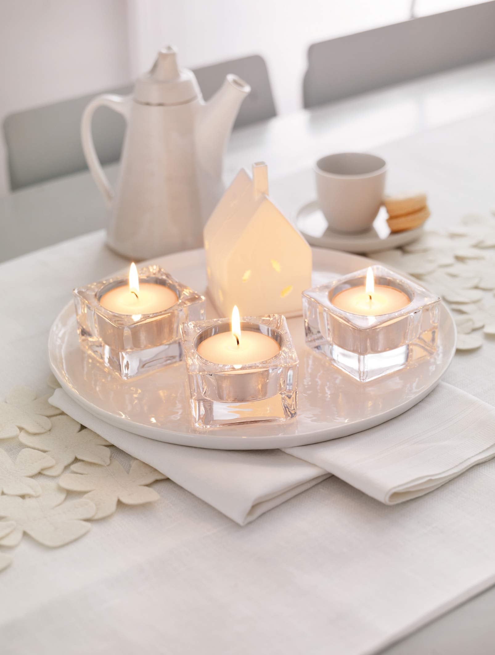 Bolsius tea light in a clear cup enhances wedding decor with soft glow