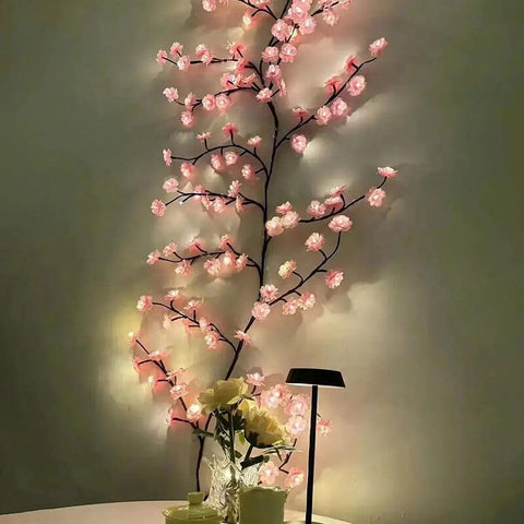 BomKra dining room ambience with warm glow from decorative branches.