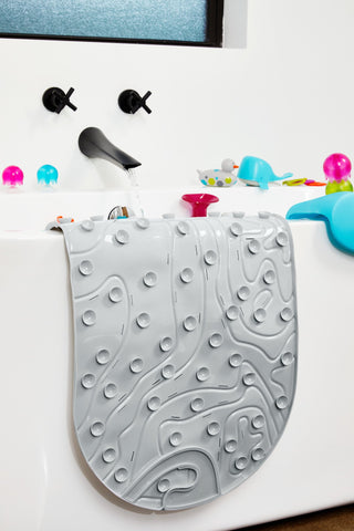 Boon Grifle gray textured mat adds soft grip to tub time.