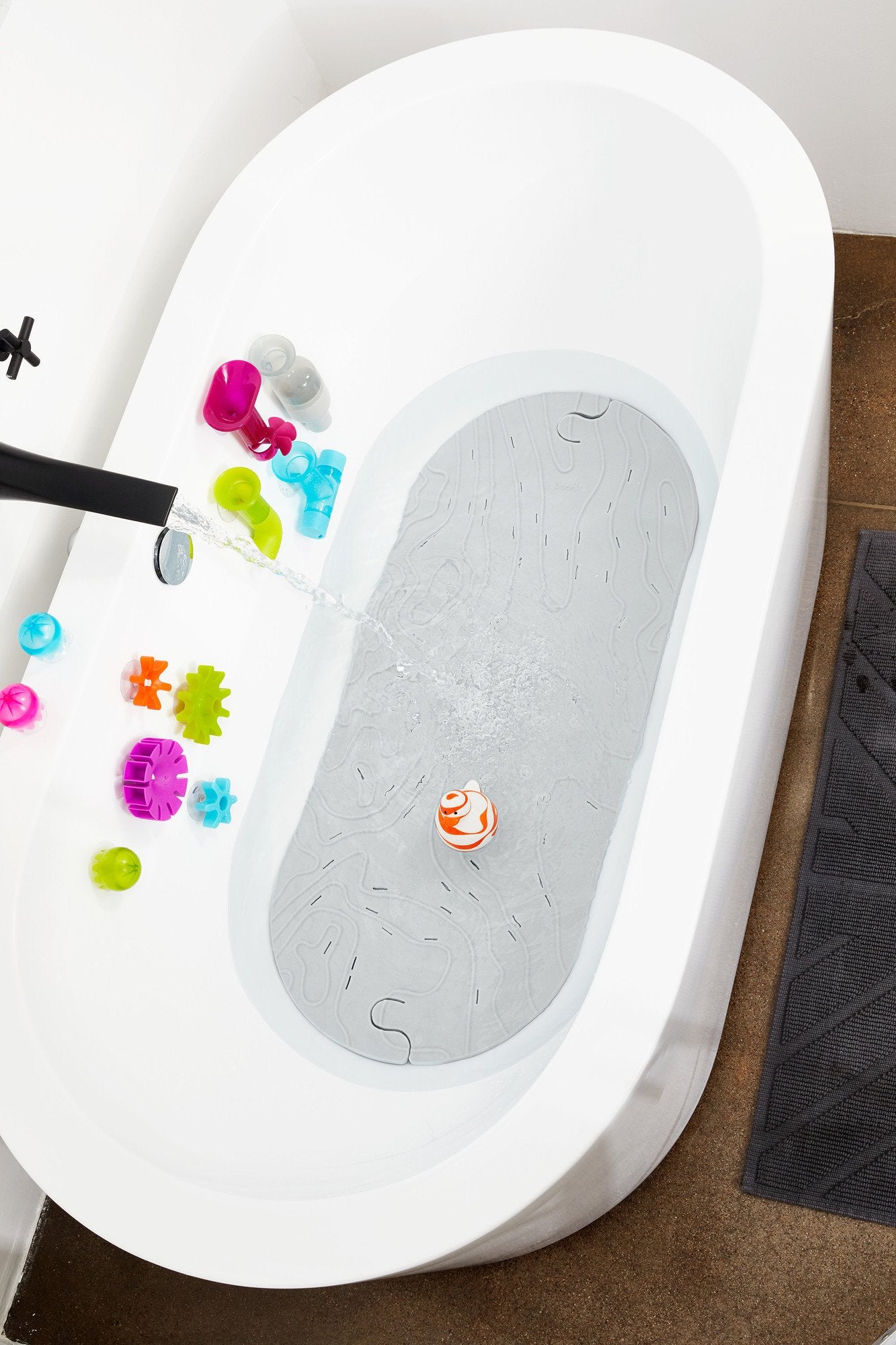 Boon Grifle large bath mat fits most tubs, 36.5 by 2.8 by 15.8 inches.