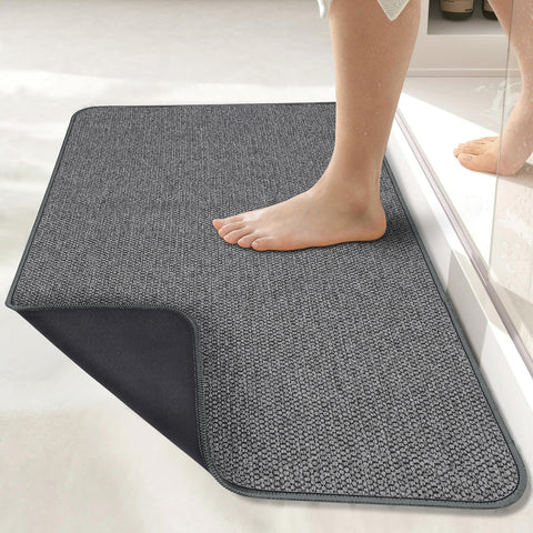 Bosap ultra-thin bath mat under a door showing space-saving design for easy clearance