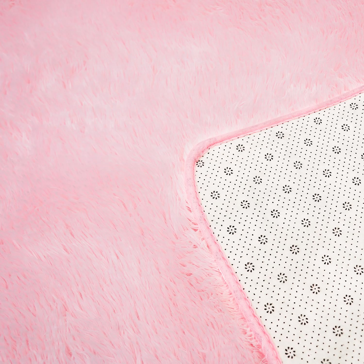 Boshengya pink shag rug being vacuumed for easy maintenance