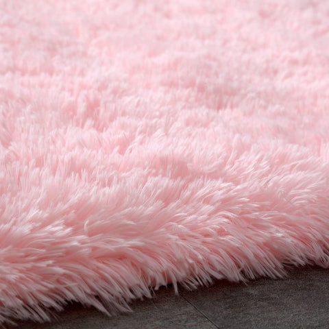 Boshengya pink shag rug beside a bed for cozy mornings and steps