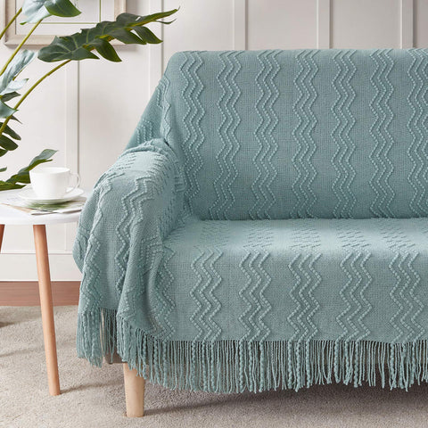BOURINA Aqua Throw Blanket draped on sofa showcases decorative pattern for stylish living rooms