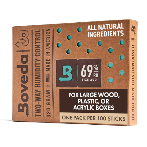 Boveda Size 320 pack inside a large wooden humidor preserves freshness.