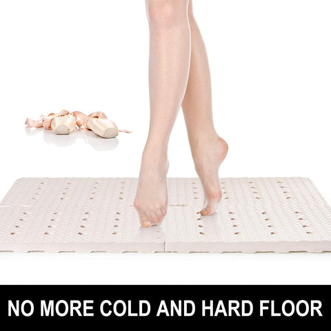 BOWERBIRD anti-fatigue mat drainage holes promote quick water runoff in showers.
