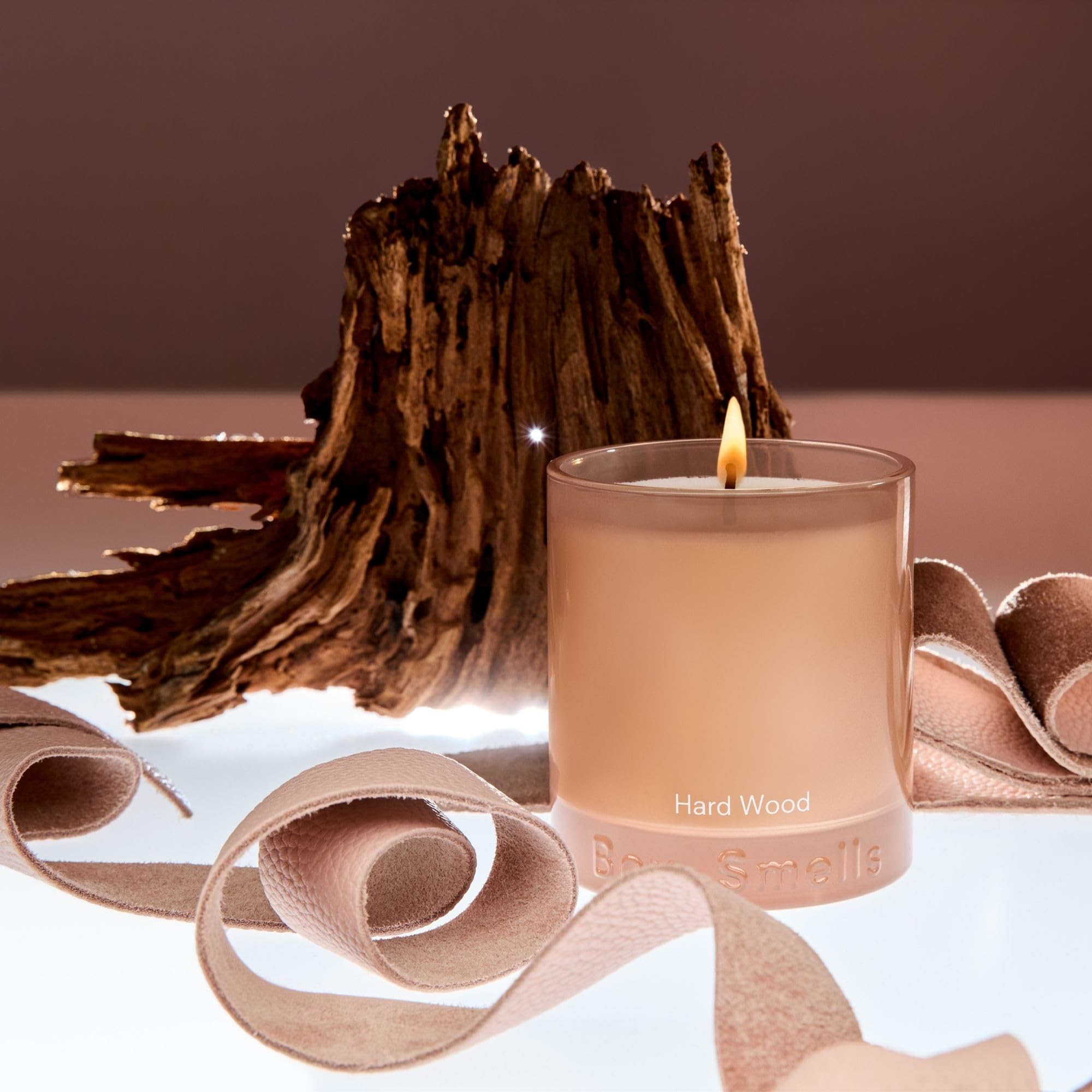 Boy Smells Hard Wood Leather Candle glossy tan glass tumbler showing leather cedarwood blend