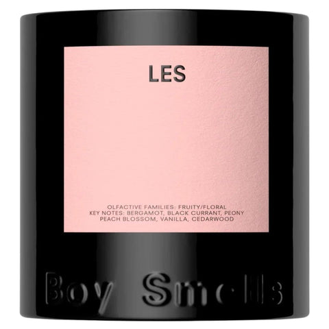 Boy Smells LES candle with peach-citrus floral blend warming your space.