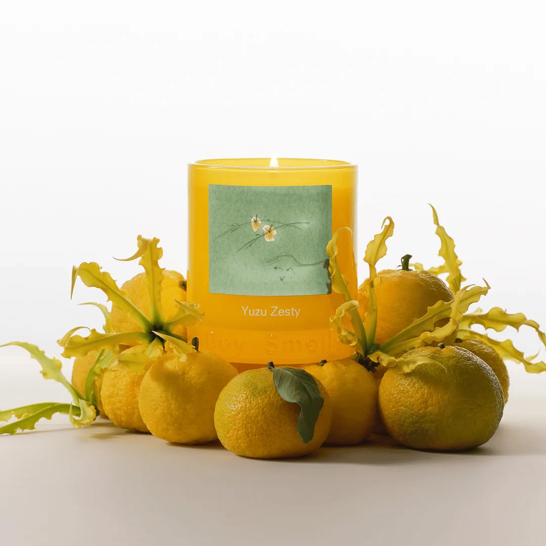 Boy Smells Yuzu Zesty candle in a cozy living room scene for mood enhancement.