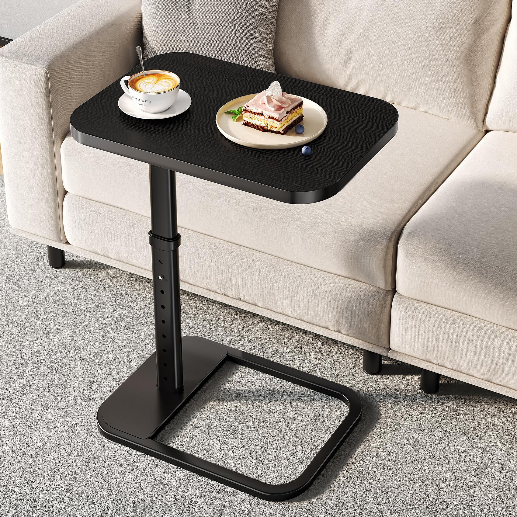 Branwick adjustable-height TV tray beside sofa for dining or laptop work.