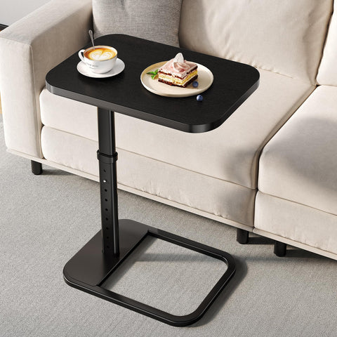 Branwick adjustable-height TV tray beside sofa for dining or laptop work.