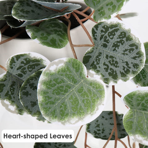 Briful artificial string of hearts draping cascades with lifelike leaves