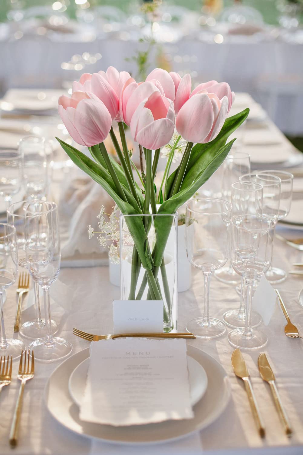 Briful bright tulips with dark leaves create striking table centerpieces