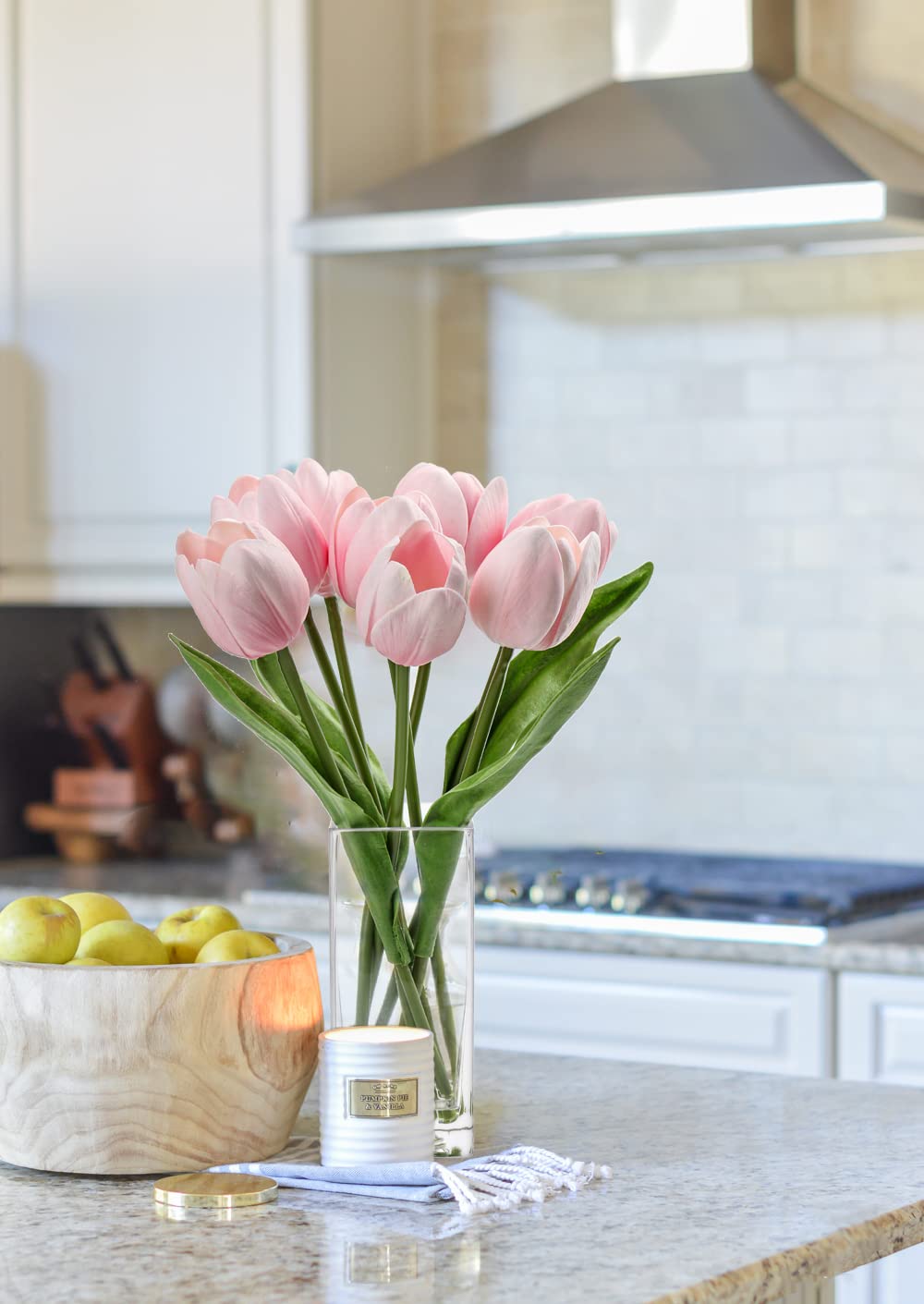 Briful clear vase displays a natural-looking tulip arrangement on any tabletop