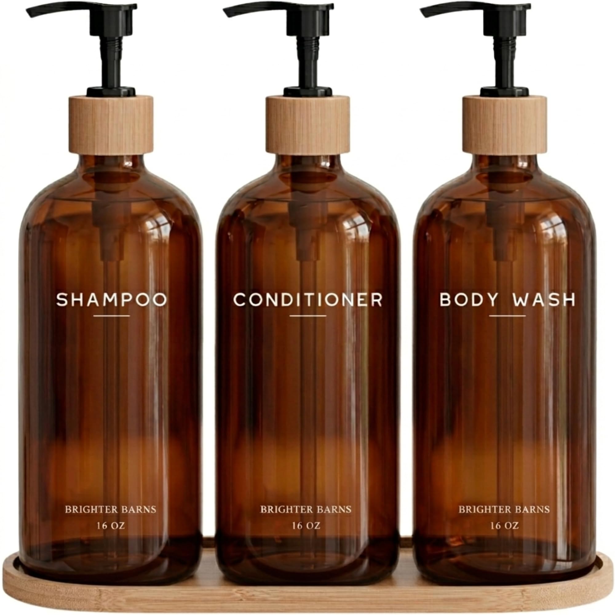 Brighter Barns amber dispenser bottles show eco-friendly, refillable bathroom storage.
