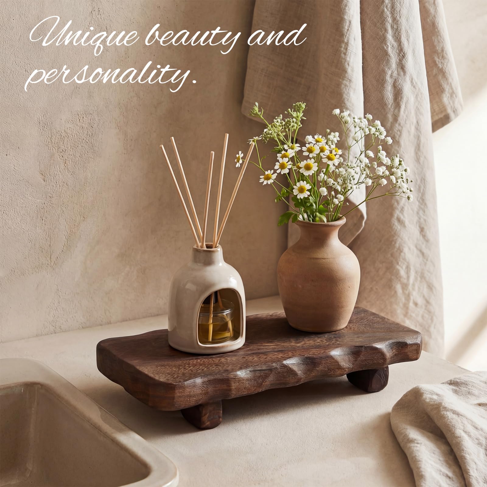 Briwooody dark brown wood riser on dresser showcases jewelry and perfumes