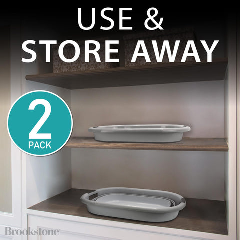 Brookstone collapsible laundry basket with comfortable handles for easy carrying.