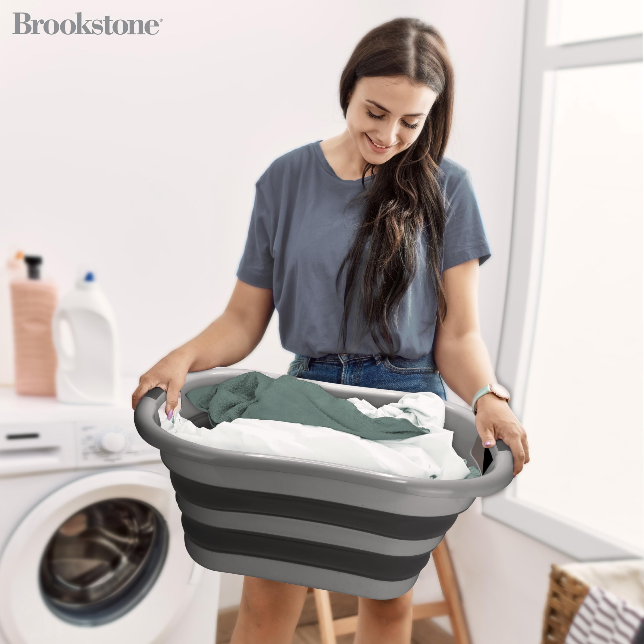 Brookstone collapsible laundry basket open to full size for larger loads.