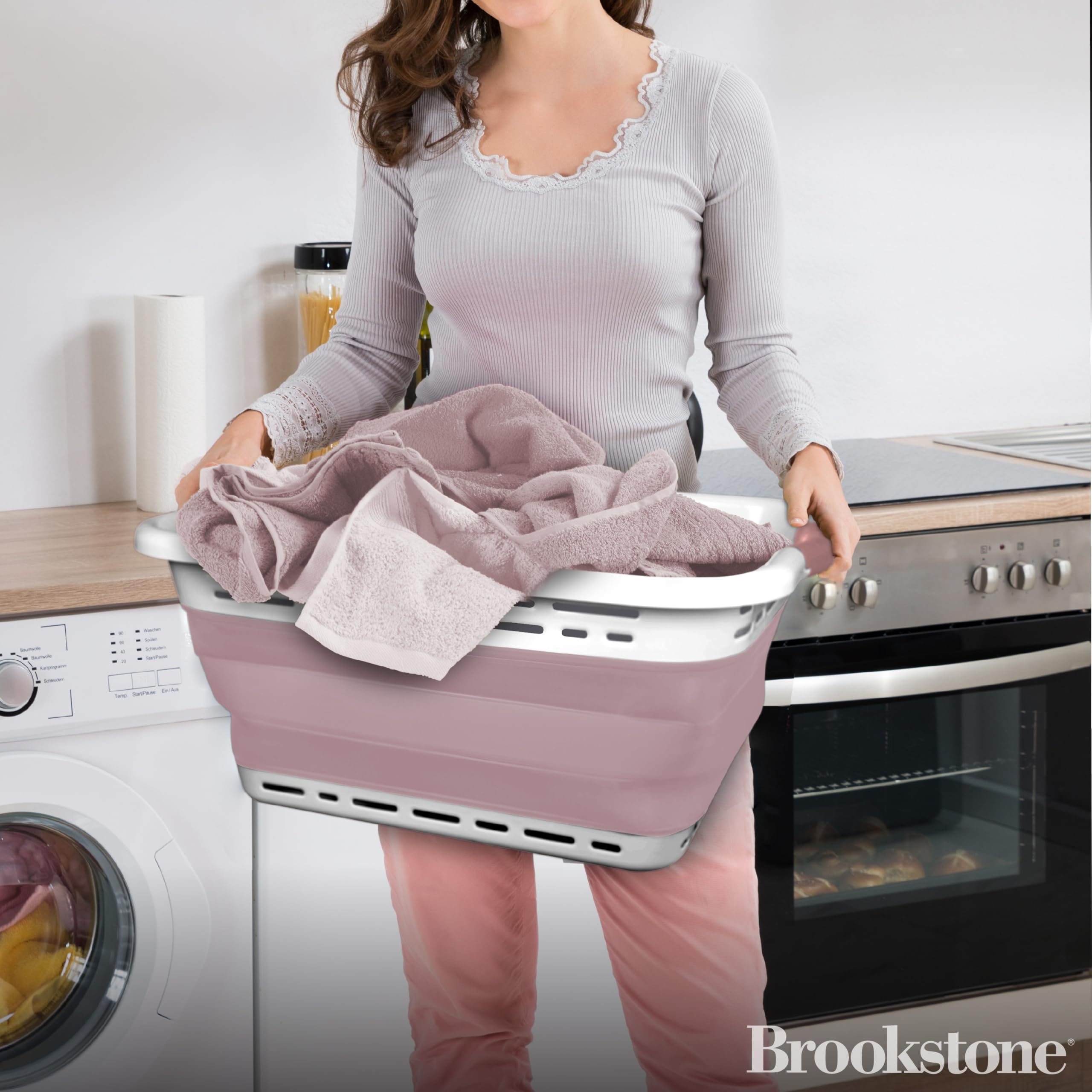 Brookstone collapsible laundry hamper folds flat for space-saving storage in small homes.