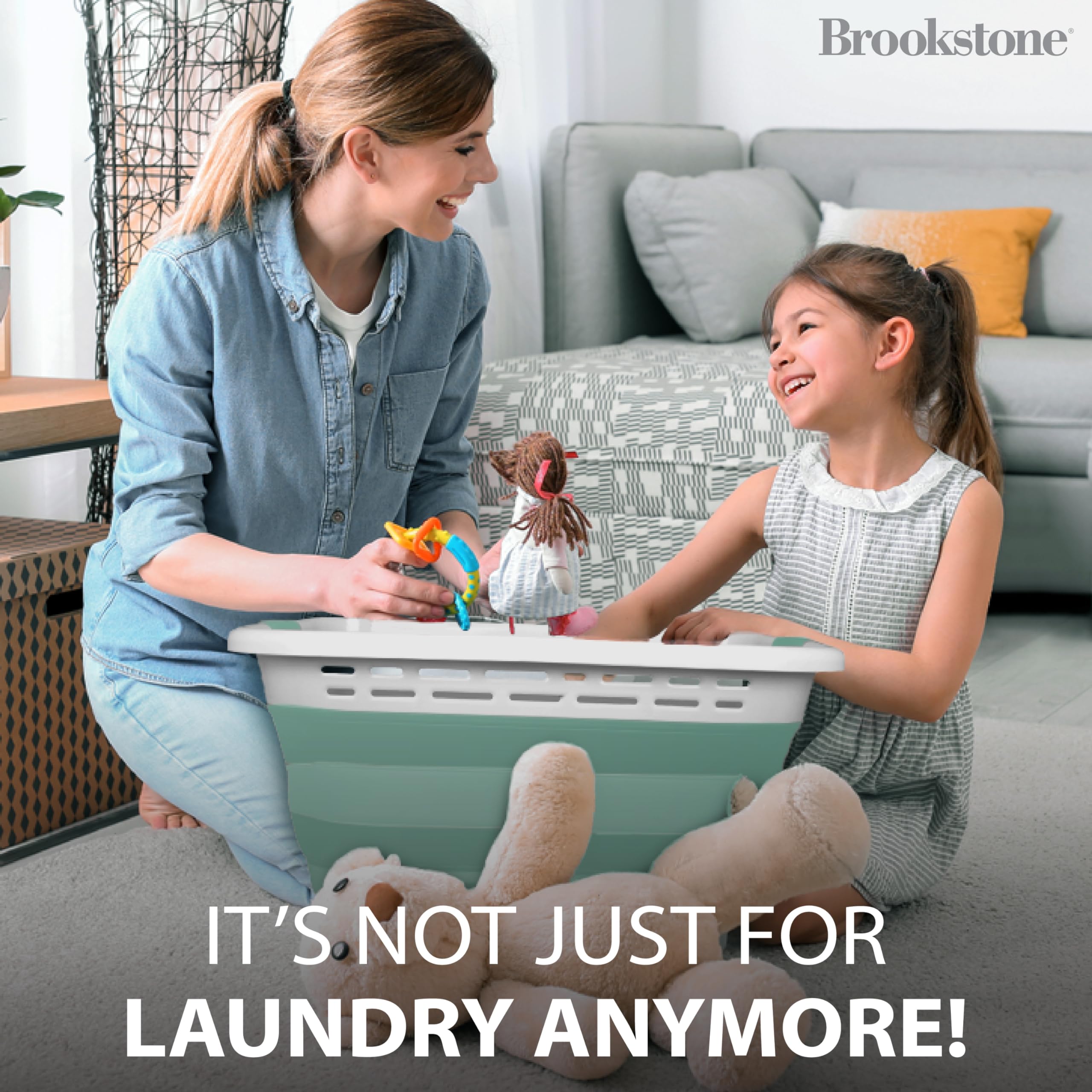 Brookstone easy-carry laundry basket with strong handles for quick transport.