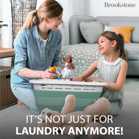 Brookstone easy-carry laundry basket with strong handles for quick transport.