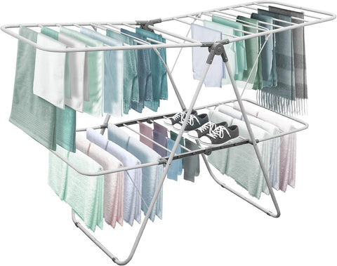 Brookstone foldable clothes rack indoors for space-saving storage.