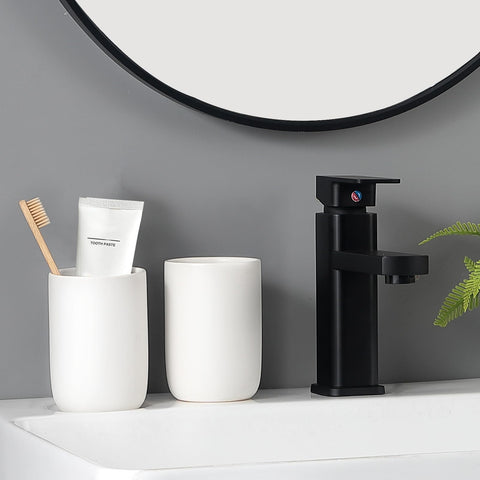 BSDISP two cups holding toothbrushes and toothpaste for quick access