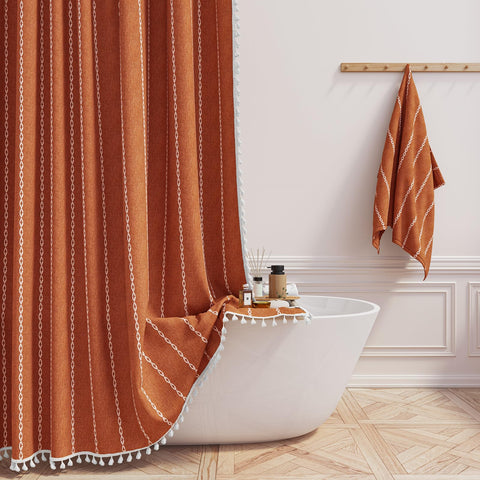 BTTN boho farmhouse shower curtain tassel detail enhances bathroom decor.