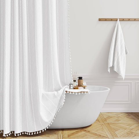 BTTN extra long shower curtain with tassel detail for a lush bathroom aesthetic.