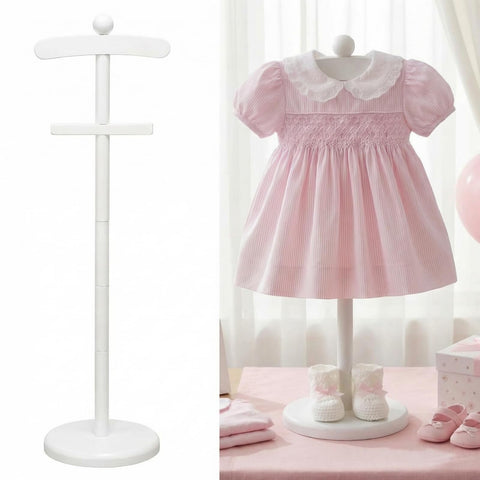 Bucherry white baby clothes display stand on a clean tabletop for neat presentation