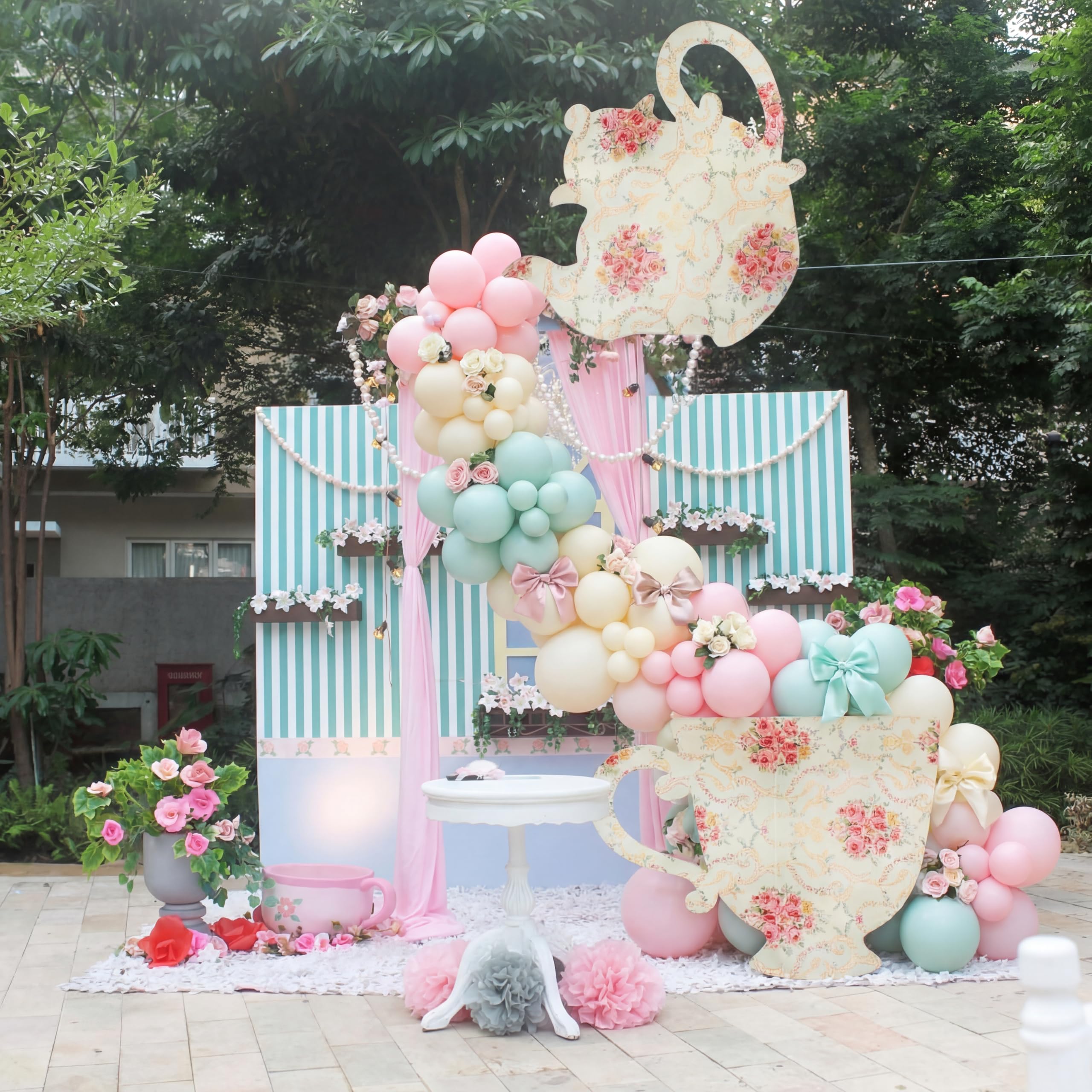 Bucherry teapot arch decor creates a charming focal point for tea parties