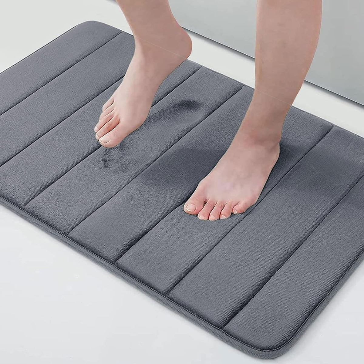 Buganda memory foam bath mat with plush velvet surface for soft, cushiony feet.