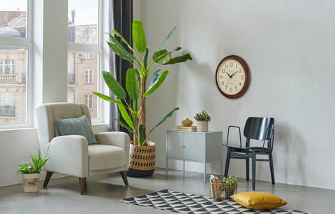Bulova Atomic Time 2 wall clock in classroom or office room setting.