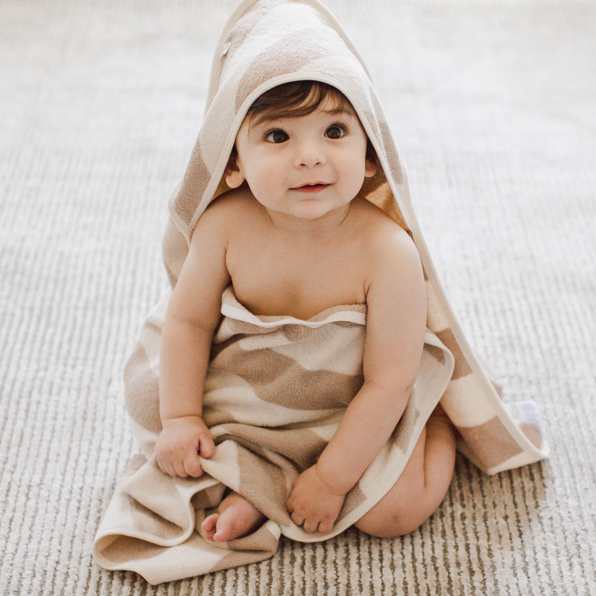 Burt's Bees Baby hooded towel hood detail keeps the head warm without covering the face.